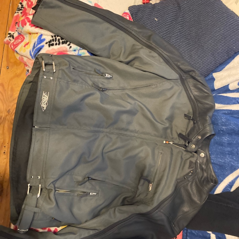 New power trip padded leather motorcycle jacket.  very nice to small for me